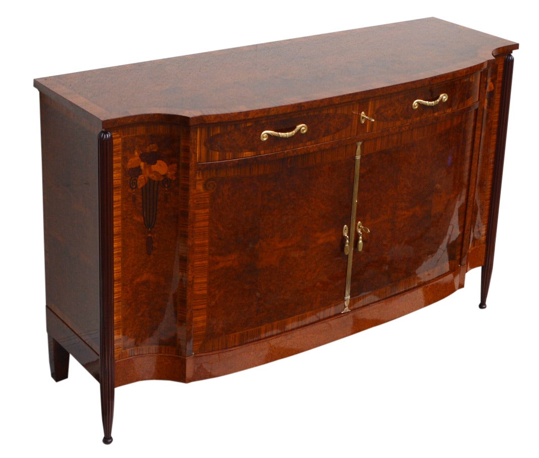 Exceptional Art Déco Period Sideboard, Paris, 1920s. Made of walnut, rosewood, and other precious wood. 

Concave sides, very detailed floral marquetry.

This sideboard is attributed to French master designer Paul Follot. Born in 1877, Follot
