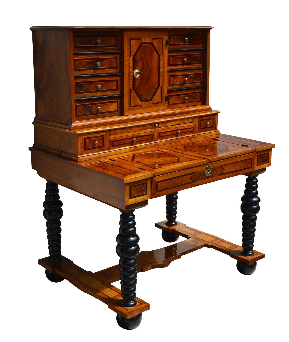 Baroque period tabernacle desk, Würzburg, 1790s. Made of walnut and other precious wood species (among them plum wood). 

Rare tablernacle desk of the highest quality. Ball feet, lathed ebonized legs. Multifunctional wiriting surface. Upper part