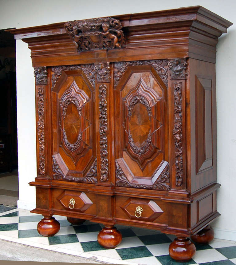 This exquisite Baroque style cabinet from Hamburg is made from the best walnut veneer on a solid oak wood core.

It is a real piece of history: The cabinet is a Hamburger Schapp, an authentic and original luxury cabinet which was in the ownership