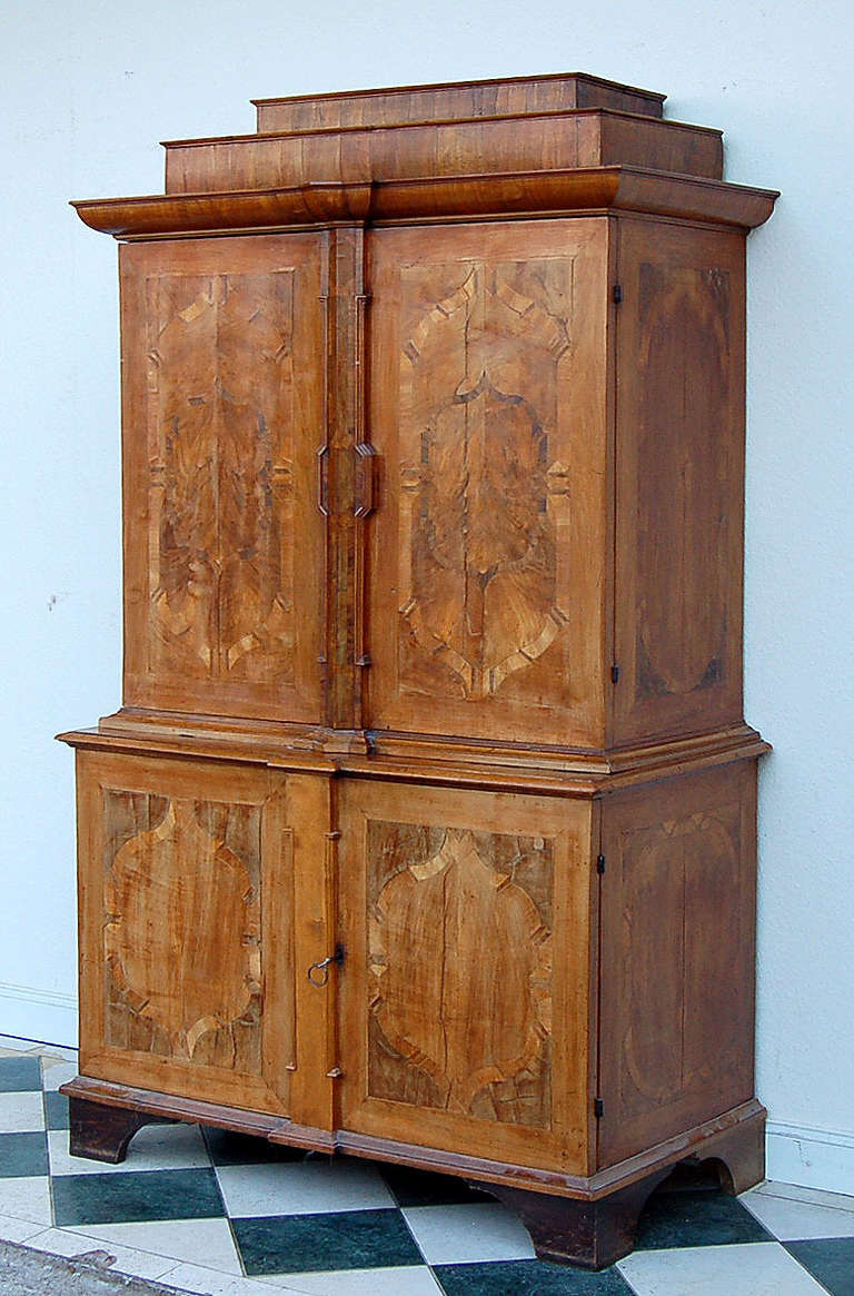 Rare cabinet closet, of courtly provenience. 
The closet is made from the finest walnut veneer. This style of closet is extremely rare and even harder to find in such a good condition. It features elegant Baroque strap work and its original looks,
