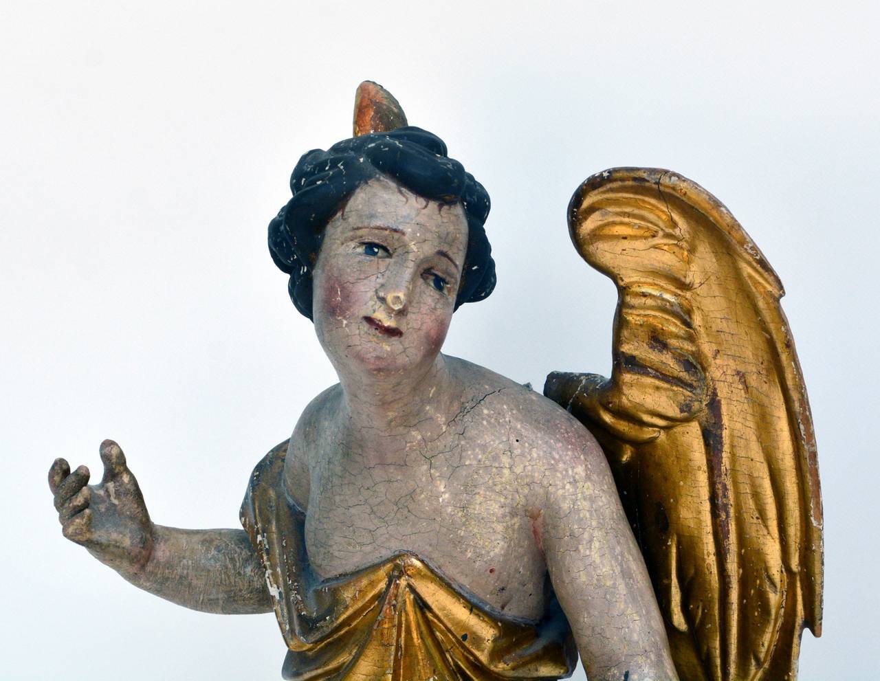 Baroque Era Sculpture of an Angel, Swabia, 1700s, partially gilded.

Detailed sculpture of an angel which is leaning forward with perspectively formed eyes. This indicates a position of this sculpture above the altar.

Provenance of Swabia, a