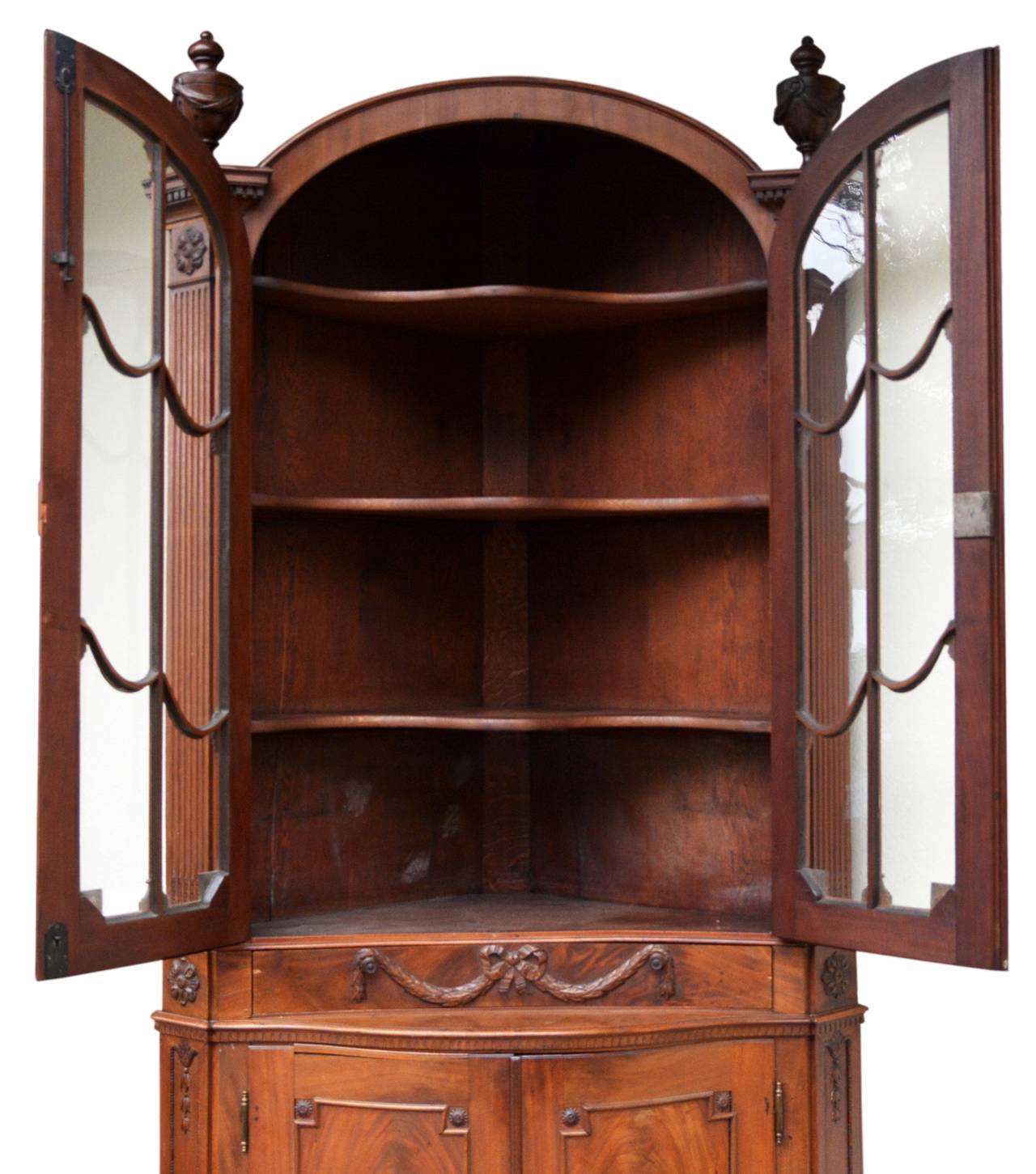 Rare Empire style corner cabinet from Luebeck, 1800s. Mahogany on oak wood ground.

Detailed ornamentation and neo-classical elements. Elegantly latticed windows. 

The corner cabinet is of the provenance of an important merchant's family from