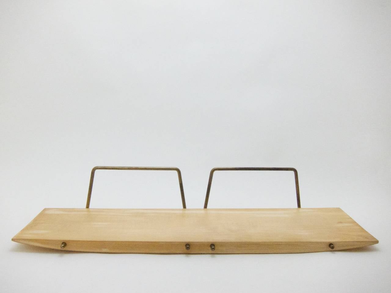 wooden Shelf by Carl Auböck
with 2 brass frames and the original hooks
