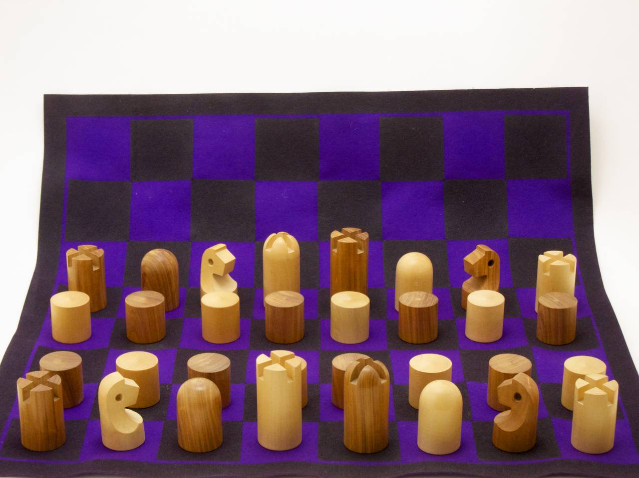 Rare, Minimalist wooden chess set by Carl Auböck
comes with a purple felt 