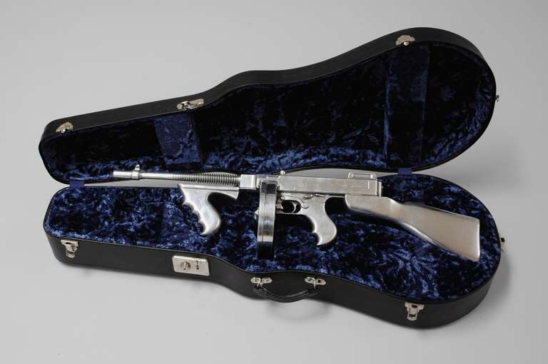 Sculpture of a Tommy Gun in a violin case
limited edition of six pieces
Titled, signed, dated and numbered: 14th February 1929, Clive Barker, 2000,
Number 1 of 6 pieces
Measures: (gun): 86 cm / 33.86 inches
(case): 106 cm / 41.73 inches.