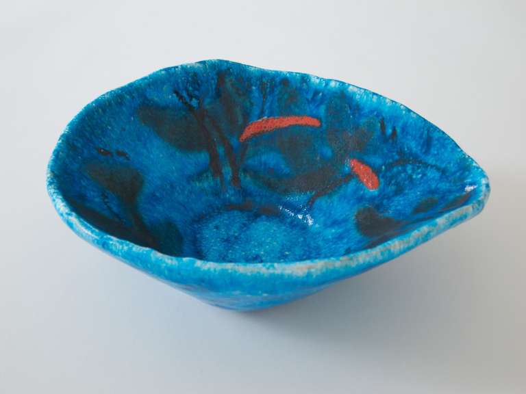 blue free-form ceramic bowl with calligraphic, black brushstrokes, some red sprinkles and craquelling glaze.
signed with the donkey logo, GAMBONE, ITALY