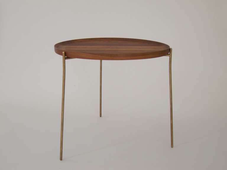 Three-legged table with a brass base and a nut wood top. The top can be removed and used as a tray.
Marked: Made in Austria