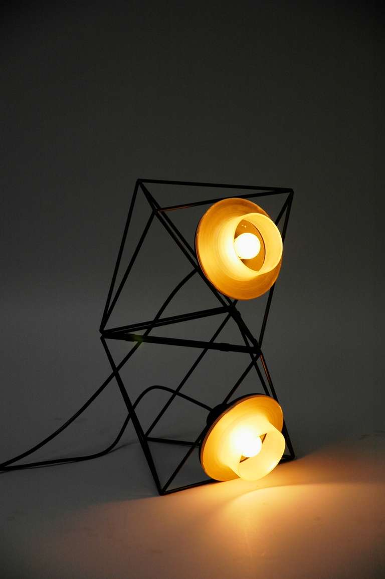 Rare pair of table, wall or ceiling lamps by Felice Ragazzo
1969 for DH Guzzini

modular light system

Polyhedron made of black painted iron rods with a black painted reflector

The polyhedrons can be combined and stacked together in countless