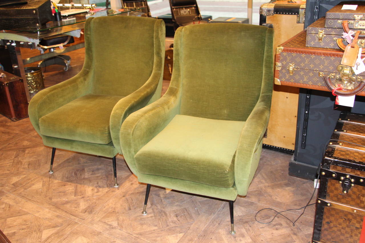 These armchairs are very elegant with their original light green velvet.They have got metal legs with brass sabots.Moreover they offer relaxing comfort.