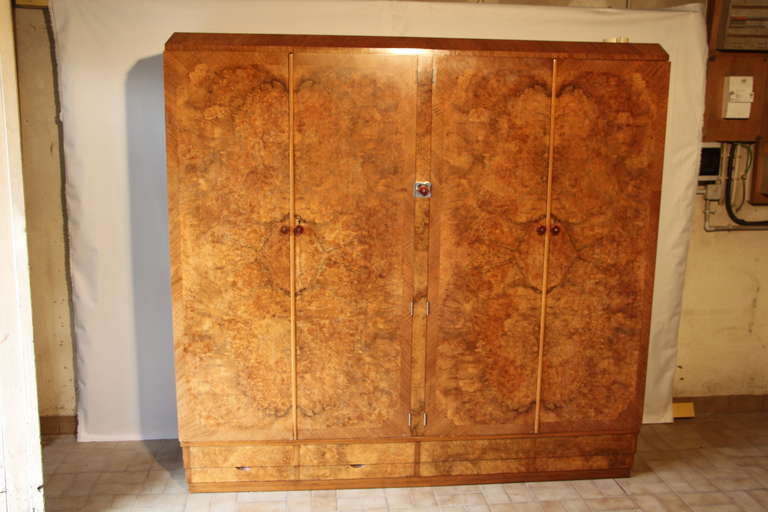 This is a very unique wardrobe from Compactom in a magnificent burr walnut exterior and a fabulous interior fitting.
The left hand side has got many glazed section,drawers,separators for shirts,as the right hand side is the hanging section,with tie