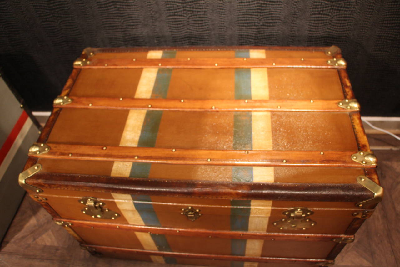 This beautiful trunk features wood slats on warm brown canvas,brass locke and fittings,leather trim and leather handles.
Its interior has been relined so it is convenient for storage.
It could also be used as a prefect coffee table.

Free