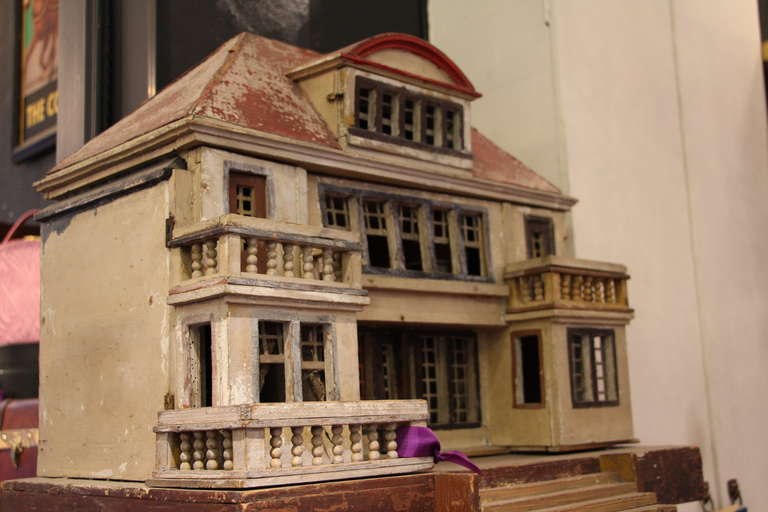 This spectacular  doll house is very detailed.All the doors and windows open.
Inside has been electrified a long time ago.
It s a perfect piece of decoration to hang upon the wall or to put on a chest or console.