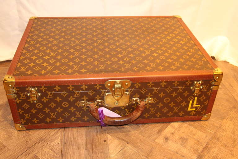 Beautiful Louis Vuitton stenciled monogramm canvas suitcase with all brass fittings.