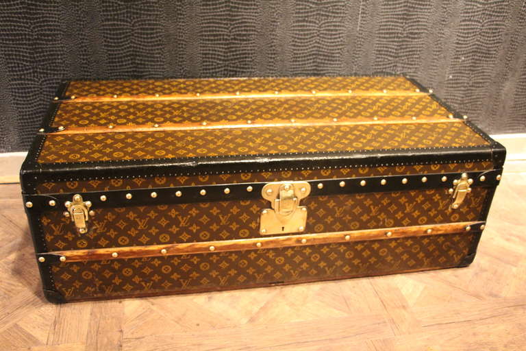 This superb Vuitton cabin trunknfeatures stenciled monogram canvas,black trim and leather handles,brass locks and original onterior with its original tray.
It has got a wood custom made stand.