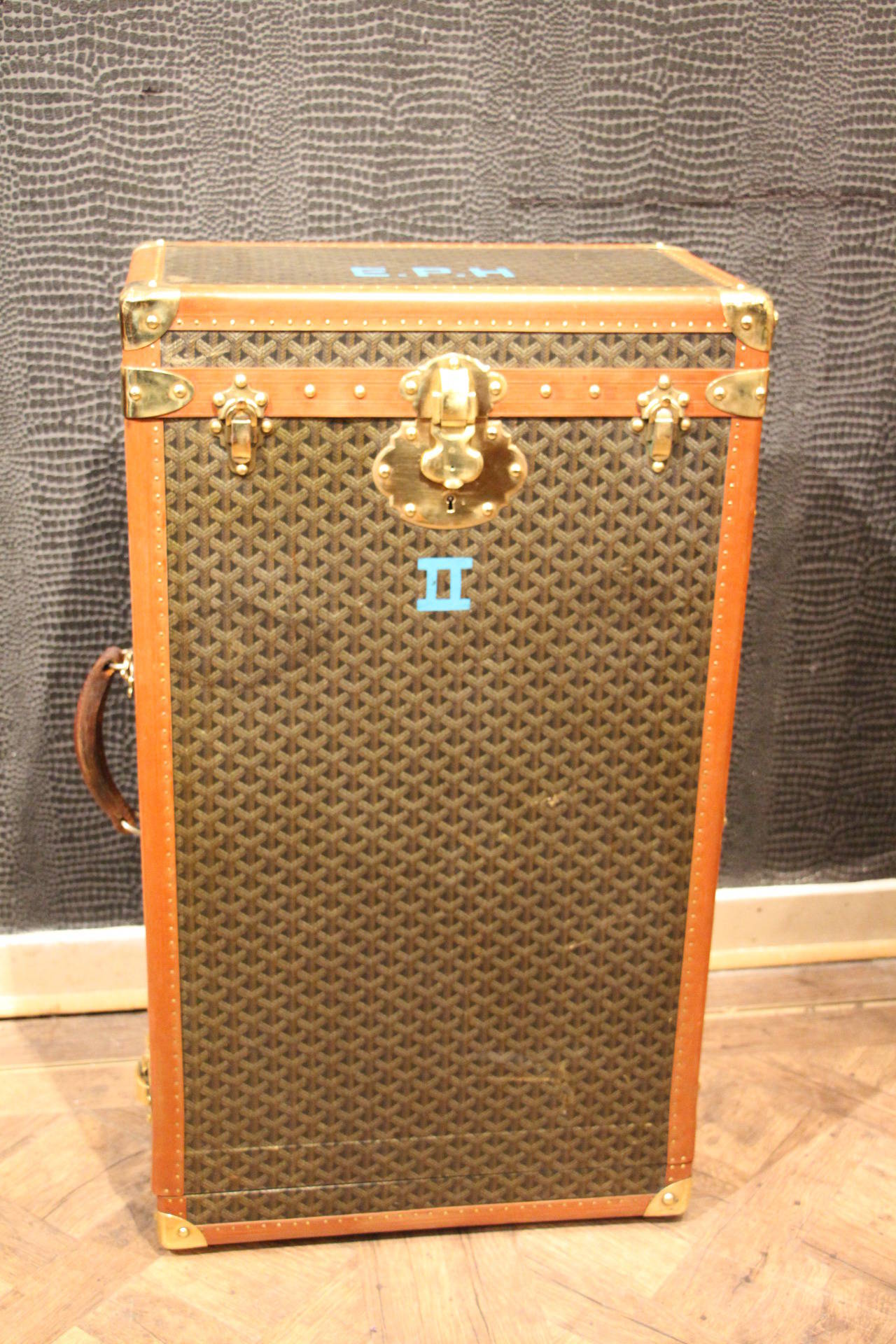 This Goyard trunk features the famous and elegant 
