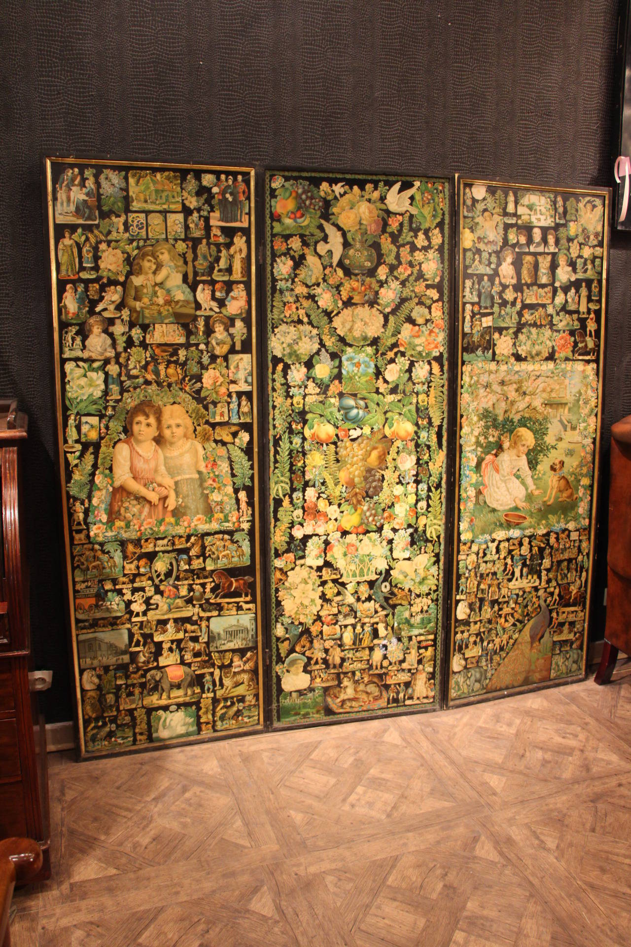 This beautiful screen is full of nice decoupage images put on canvas with a black wood frame.
It is decorated on both sides and is in pretty good condition.
It is very elegant because there are many images on a black base.