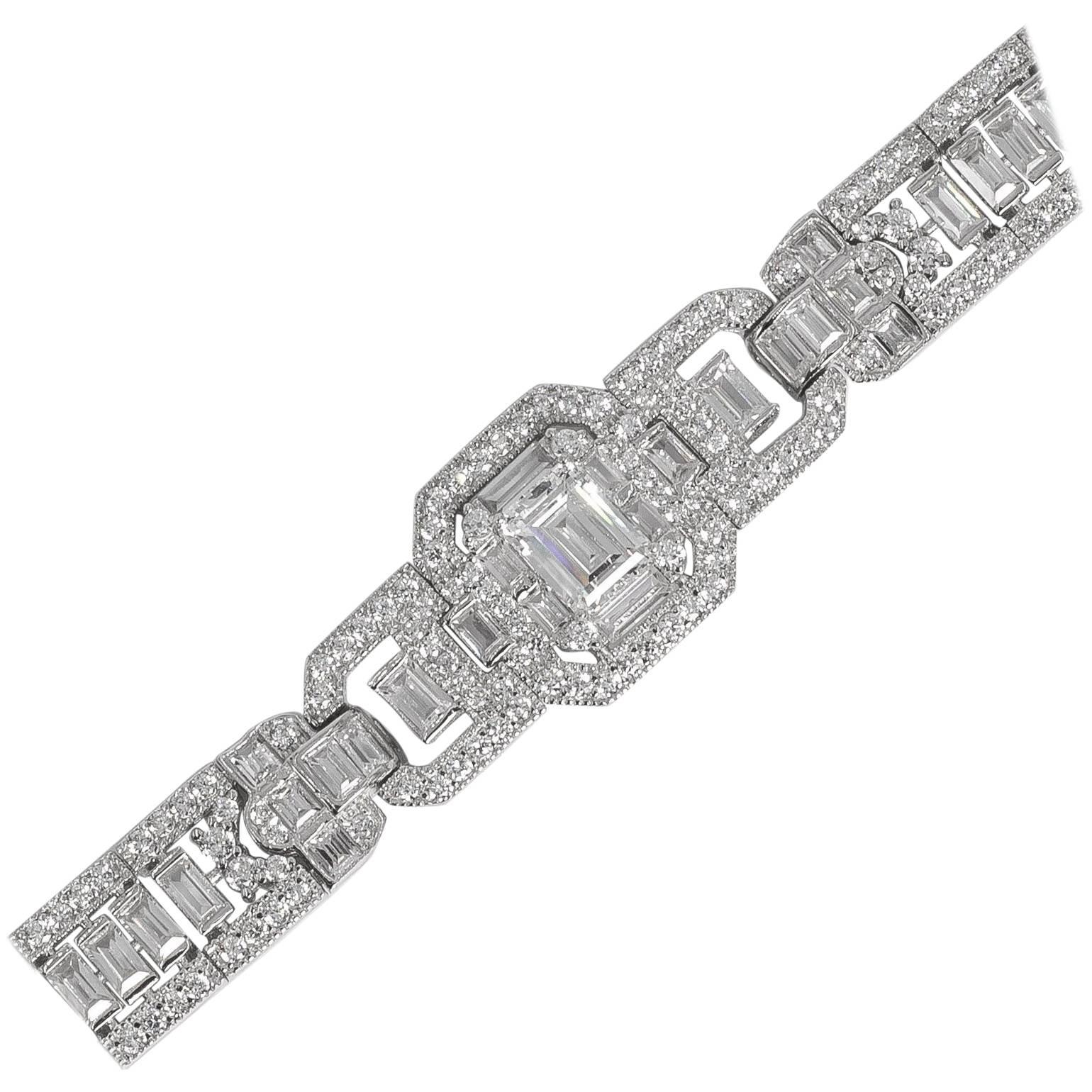 Art Deco style diamond  costume jewelry bracelet hand made and hand cut cubic zirconia hand set in non tarnish rhodium sterling silver. Baguettes running through the center edged with round stones all flexible center set art deco motif with 3 carat
