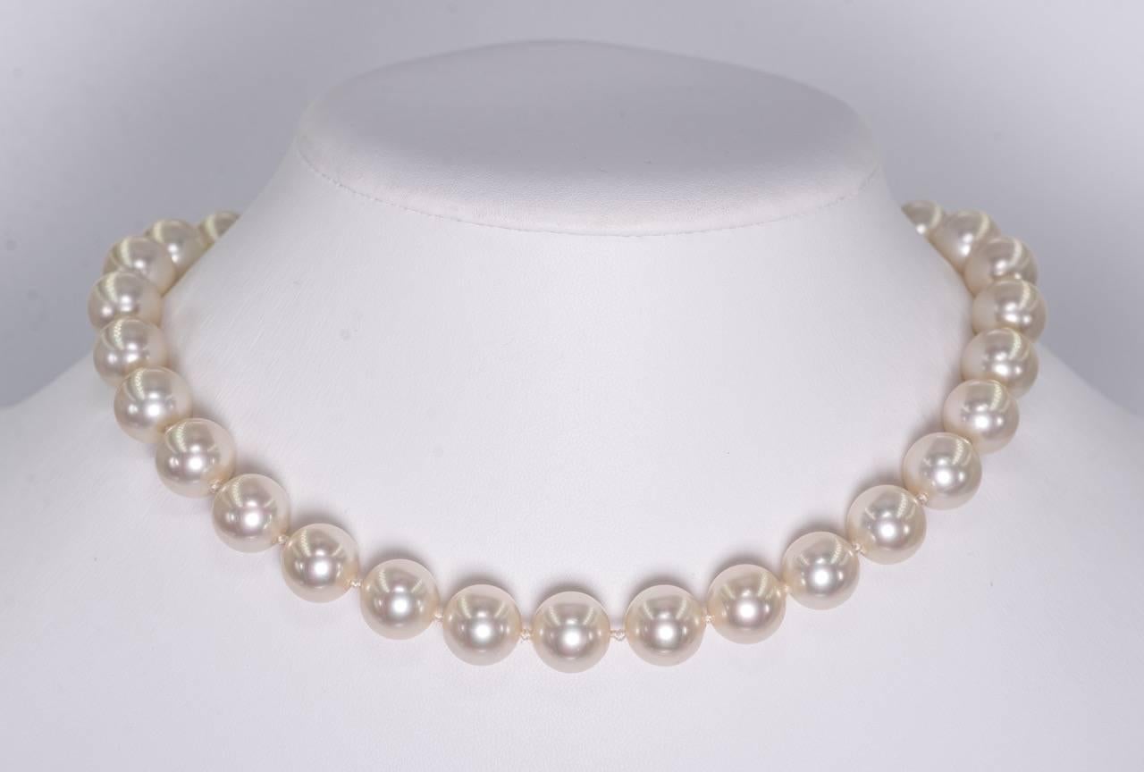 Shades of Grace Kelly in this mint vintage unworn Bergdorf Goodman classic 12mm (1/2''diameter) single strand faux pearl necklace. These handmade Japanese exclusive glass pearls are 12mm and are hand knotted and strung on silk. Simple pave set cubic