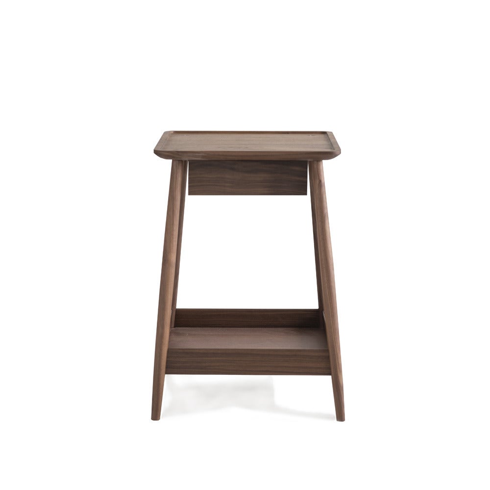 The Harlosh is a bedside table with a floating dovetailed drawer and a lipped shelf below. It may also be used as a side table. Available in Walnut. Please allow 14-16 weeks for lead time.