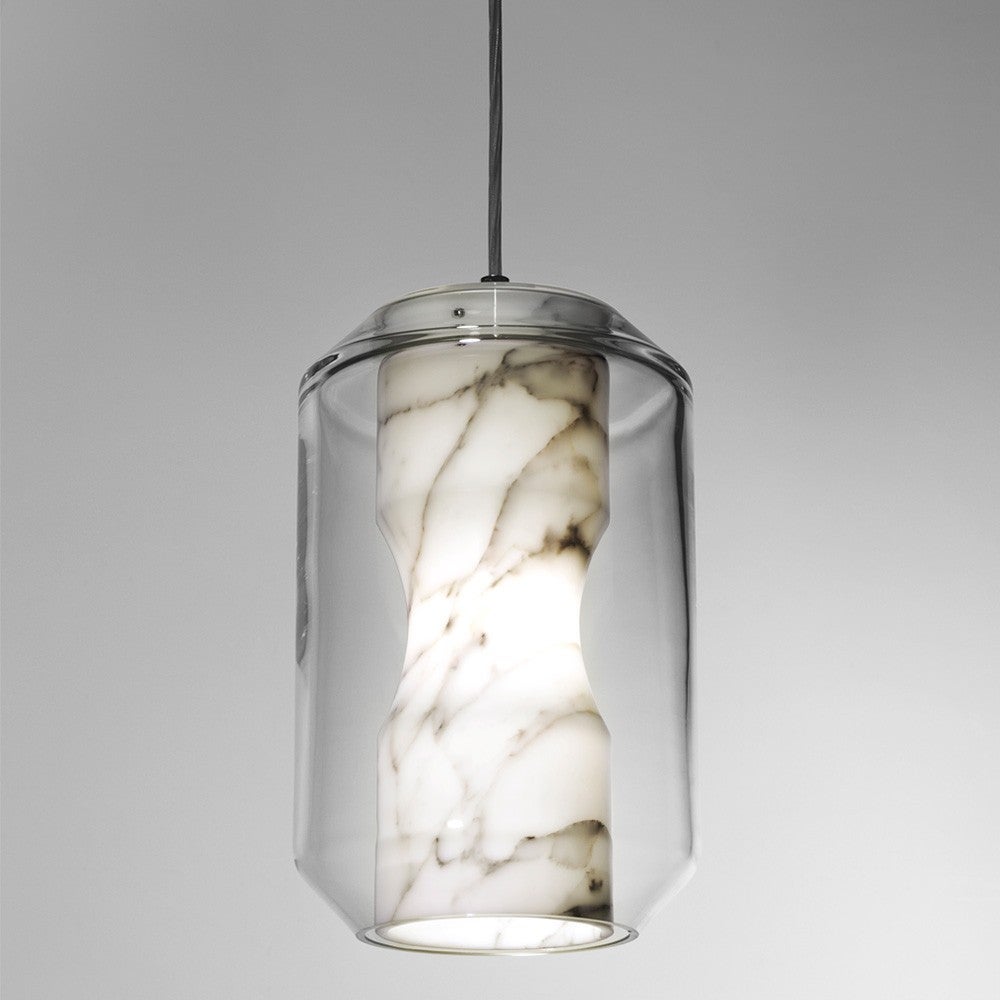 Housing a sculptural Carrara marble diffuser within a lead crystal vessel, Chamber expresses the unexpected translucent qualities of marble in a compelling decorative pendant. With its gentle luminosity and Directional downlight, Chamber is