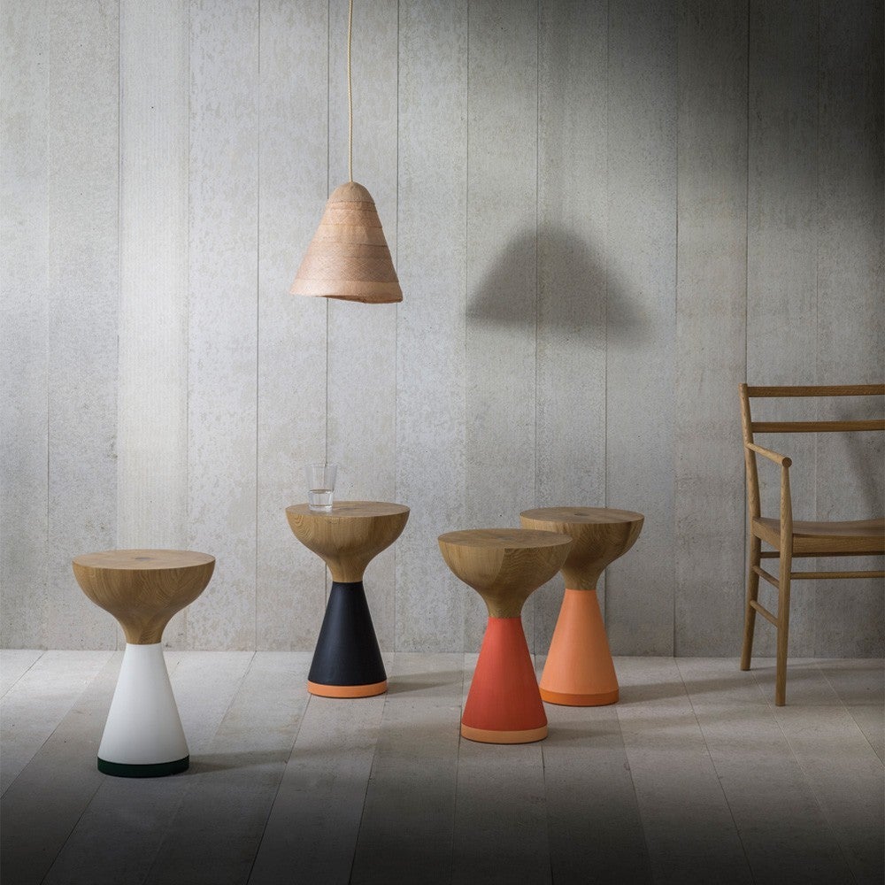 A series of side tables of varying shades and combinations inspired by fishermen’s floats. Hand turned and individually stained in a selection of colors.

Coral/Peach, Black/Carrot or White/Fern.