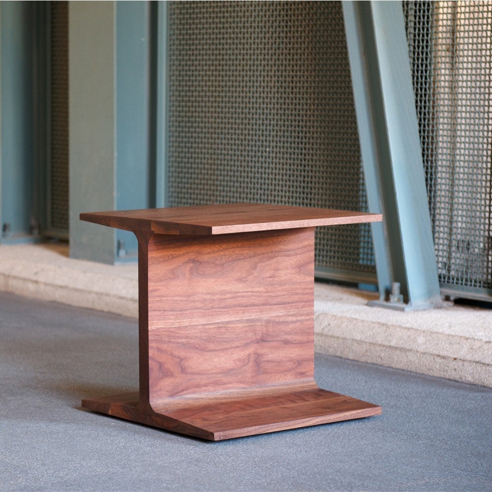 This side table, which can also function as a stool, transforms an industrial shape with the warmth of solid wood.

Price listed is for the I-Beam table in Walnut. Also available in American white oak or European Ash in a range of finishes. Please