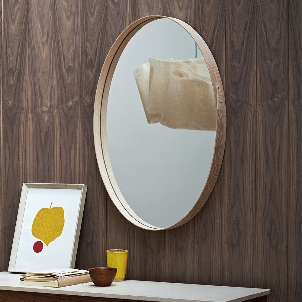 Pinch's Iona Wall Hung Mirror, is an elliptical mirror with a shaker-style joint, featuring brass rivet detail at one side and a split baton on the rear for ease of hanging. This mirror can be positioned either vertically or horizontally. 

The
