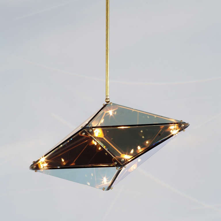 Bec Brittain's Maxhedron is a study in material transformation through light and reflection. When off, the partly-translucent Maxhedron reflects and blends with its environment; when on, the dazzling inner constellation of bulbs projects bands of