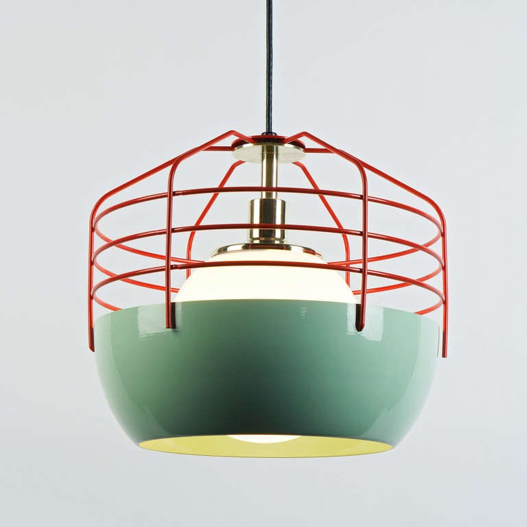 Jonah Takagi's Bluff City for Roll & Hill merges a traditional pendant shade and a wire-cage into an industrially inspired, yet refined pendant. Powder coated metal encloses a bulb and a copper plated socket. While this combination gives the