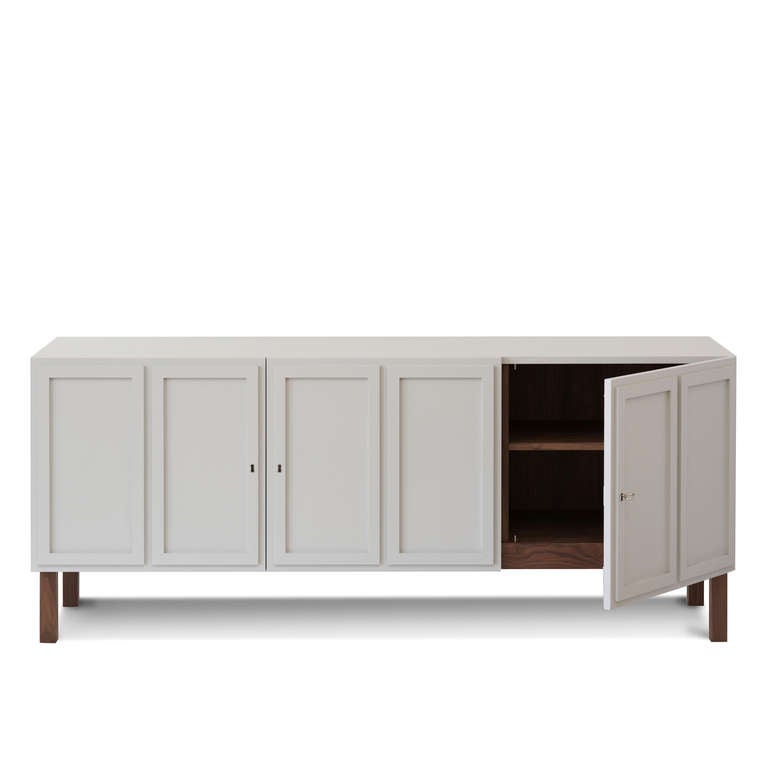 The Frey sideboard has three double panelled doors which open to reveal timber-lined locking cupboards, each housing an adjustable shelf and integrated cable access in the base.