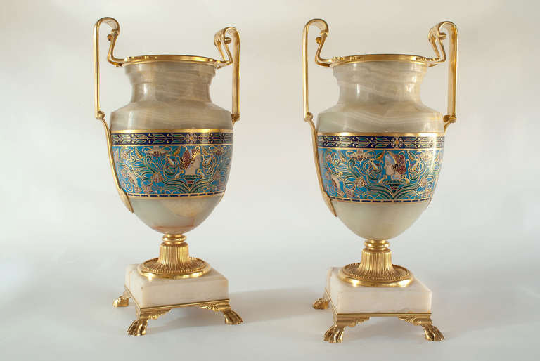 Pair of large  Neoclassical amphora vases in onyx-marble,'Champleve' enamels and gilded bronze.

Engraved signature: 'F. Barbedienne' on the neck.
Monogram signature of the chaser: 'fff' under the vases.
Model attributed to ornamentalist