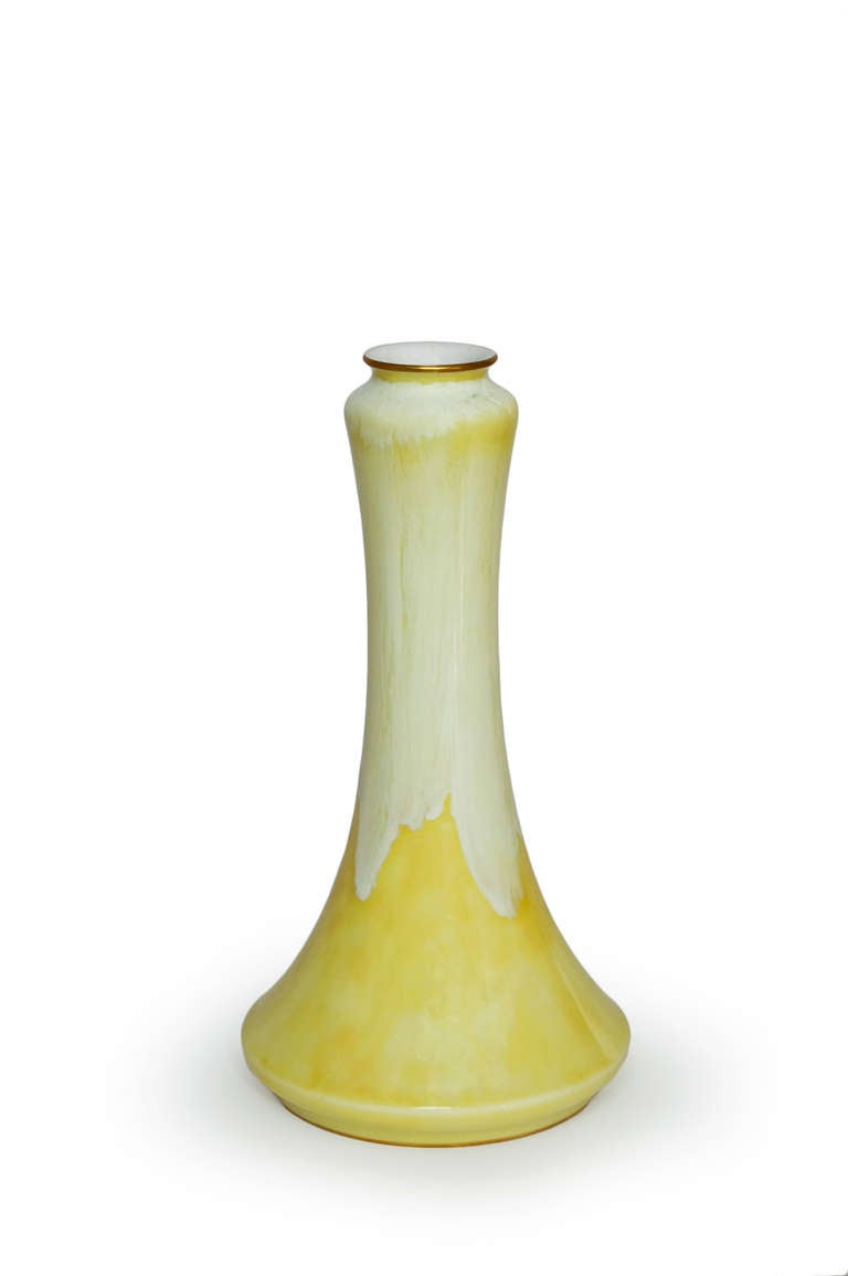 'Bussy' model vase. 'Pâte nouvelle' (PN) paste piece with a yellow background, a decor of large cream white spellings and embellished with gold.

'Bussy' shape designed in 1897 by Alexandre Sandier for the Manufacture Nationale de