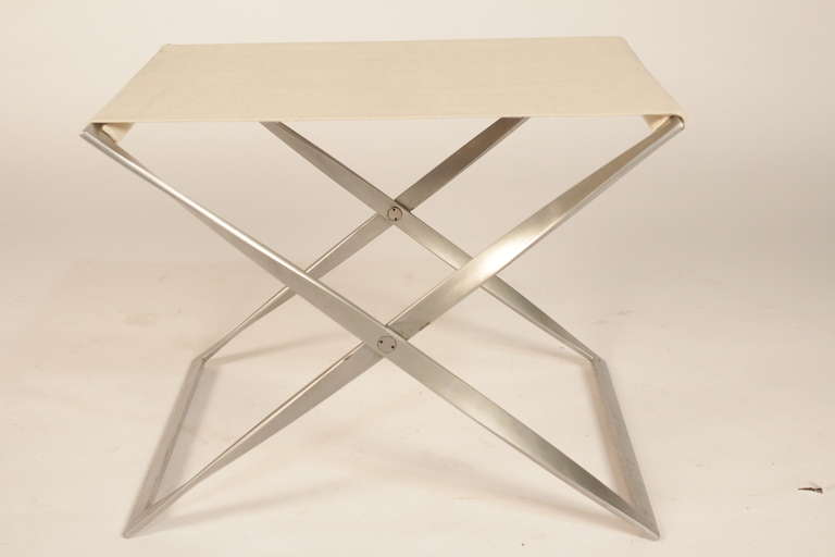 Poul Kjaerholm PK91 folding stool with chromed steel frame. Seat in light colored canvas. Edition E. Kold Christensen, stamped. Made in 1961. Scandinavian modern.
Height: 15in. / 73cm. Length: 24in. / 60cm. Width: 18in. / 45cm.