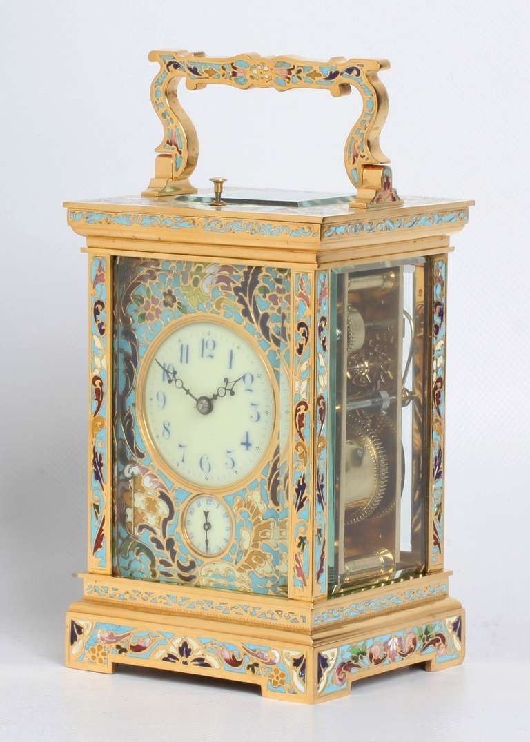 5-cm dial with blue Arabic numerals and perced blued hands, mounted in a fine cloisonné enamel mask adouurned with branches and flowers, alarm subsidiary below, spring-driven movement with platform lever escapement and of 8-day duration, half hour