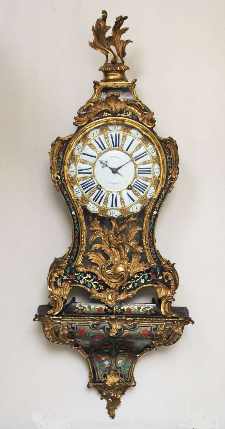 ormolu ornate relief dial with twentyfive enamel cartouches, Roman numerals for the hours and Arabic numerals for the minutes, centre signed Fortin A Paris, blued shaped hands, similarly signed 14-day movement with verge escapement and silk