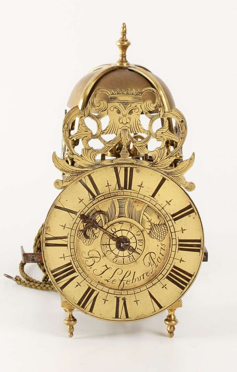 12.5-cm engraved chapter ring with Roman numerals and centre signed B.J. Lefebvre A Paris, single iron hour hand and brass alarm disc, weight driven brass posted movement with verge escapement of 30-hour duration, alarm on a surmounted bell with urn