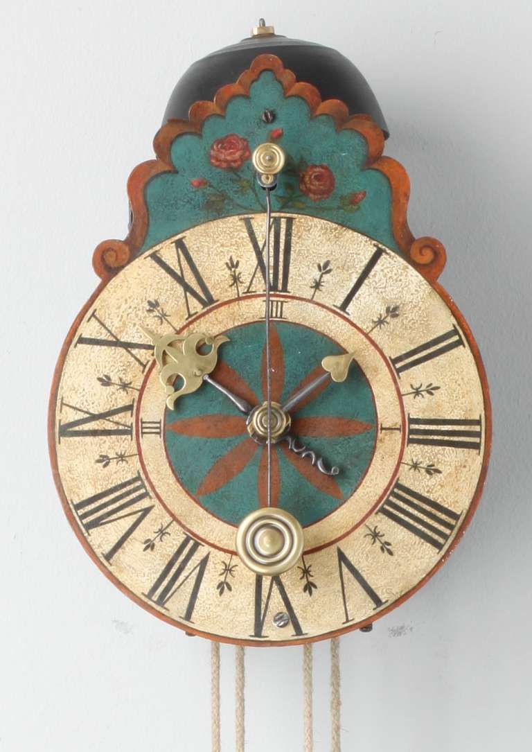 18.7-cm polychrome painted iron dial with Roman numerals and inner quarter marking, shaped cresting with roses, iron hands with brass tips, 30-our weight driven movement with verge escapement and front pendulum, square iron posts and double top
