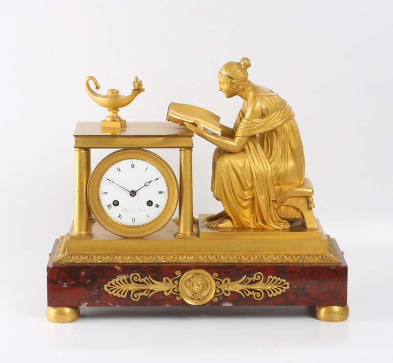 A rare French Empire ormolu and marble mantel clock, Sappho, circa 1800