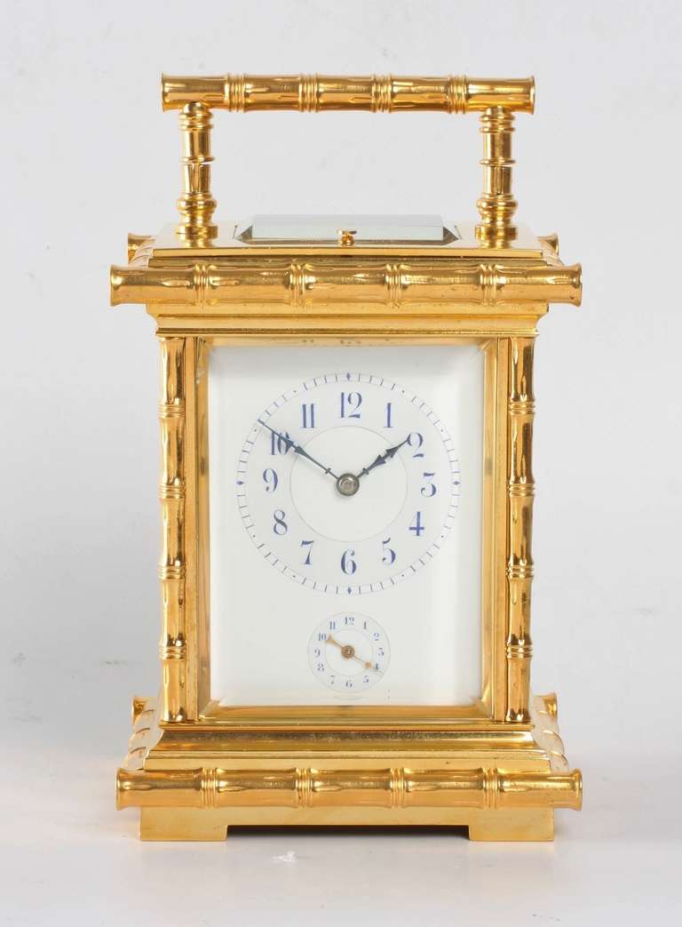 6.5-cm enamel dial with blue Arabic numerals, blued steel hands and alarm subsidiary below, spring-driven movement marked L.F. Paris with platform anchor escapement of 8-day duration, rack haf hour striking on a gong with repeating on demand, alarm,