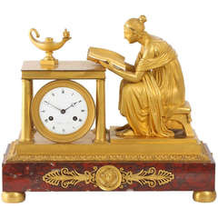 A rare French Empire ormolu and marble mantel clock, Sappho, circa 1800