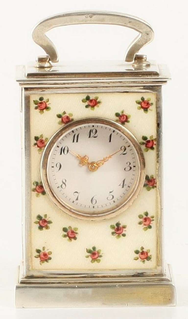 2.3-cm enamel dial with Arabic numerals and finely foliate pierced gilt hands, 8-day spring-driven jeweled movement with balance and lever escapement numered 11625, rectangular moulded 900/1000 silver case marked on the inside of the door and bottom