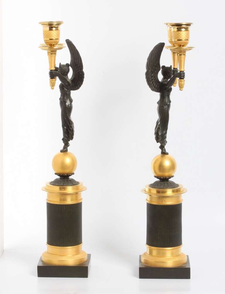 Charles X A pair of French gilt and patinated bronze 2-light  candelabra, circa 1830.