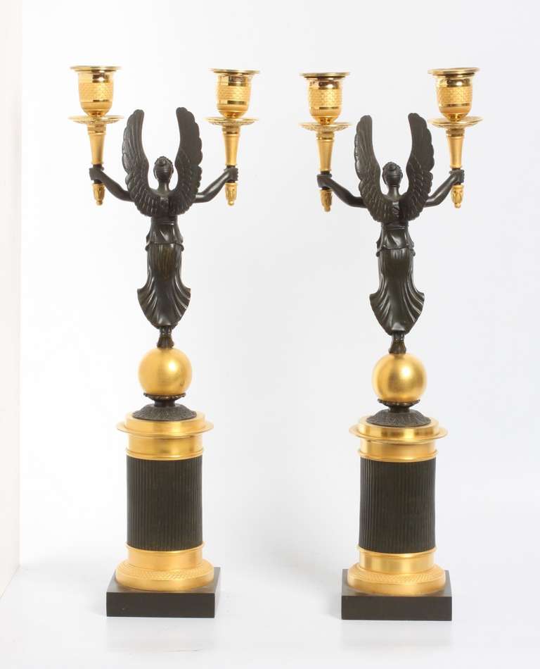 A pair of French gilt and patinated bronze 2-light  candelabra, circa 1830. In Excellent Condition In Amsterdam, NL