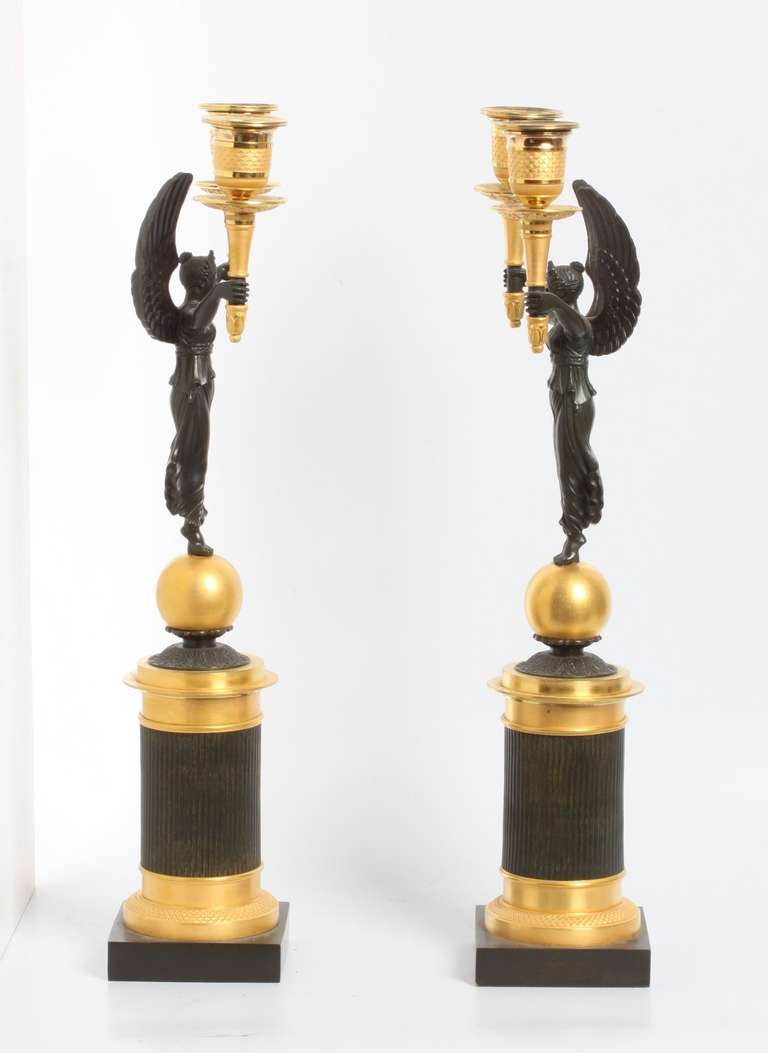 19th Century A pair of French gilt and patinated bronze 2-light  candelabra, circa 1830.