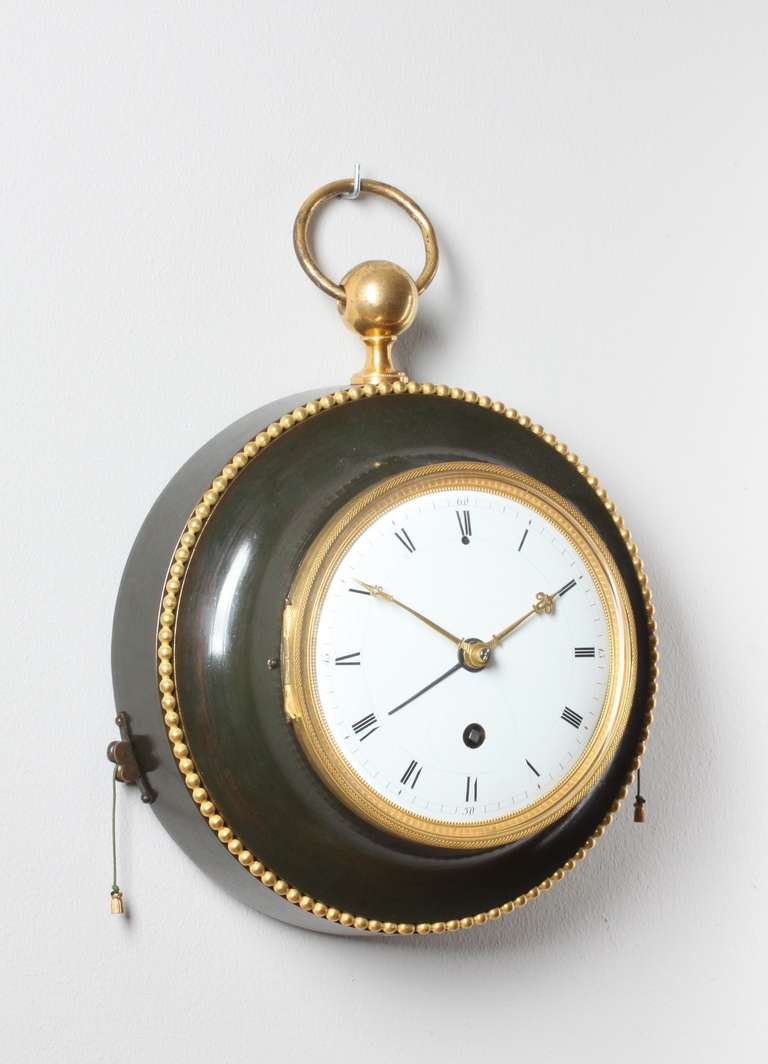 14-cm enamel dial with Roman numerals, pierced gilt and engraved hands and blued steel alarm pointer, spring driven movement with anchor escapement and silk suspended pendulum of - day duration, pull quarter repeating on a bell, pull wind alarm on a