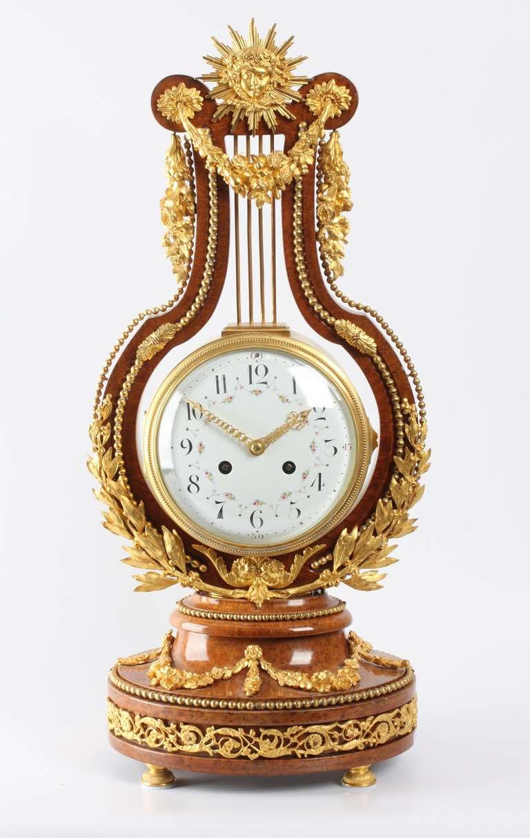 13-cm enamel dial with Arab numerals and polychrome garlands, finely pierced gilt brass hands with fleur-des-lis tips, eight day spring driven movement signed Planchon A Paris with anchor escapement and countwheel half hour striking on a bell, fine