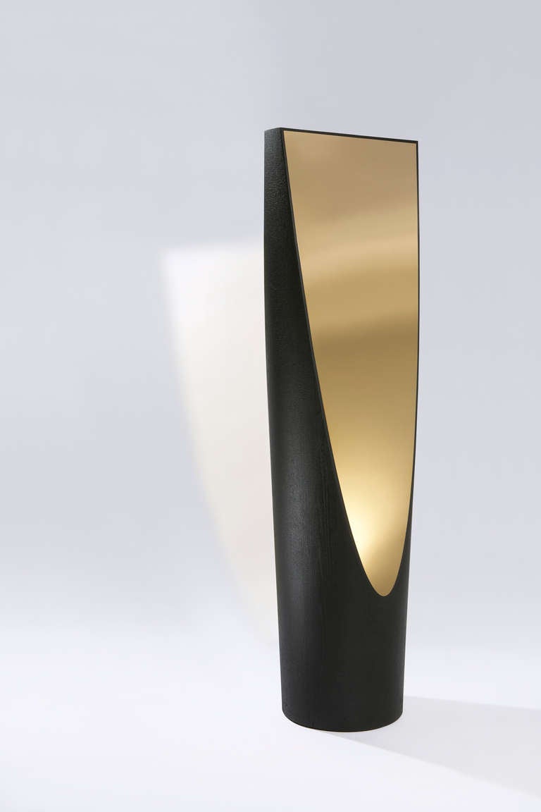 Ciel et Terre mirror by Hérve Langlais for Galerie Negropontes, Charred wood and polished brass 

Hervé Langlais is a graduate of the Normandy School of Architecture in Rouen. He collaborated with Paul Andreu for over fifteen years, working on the