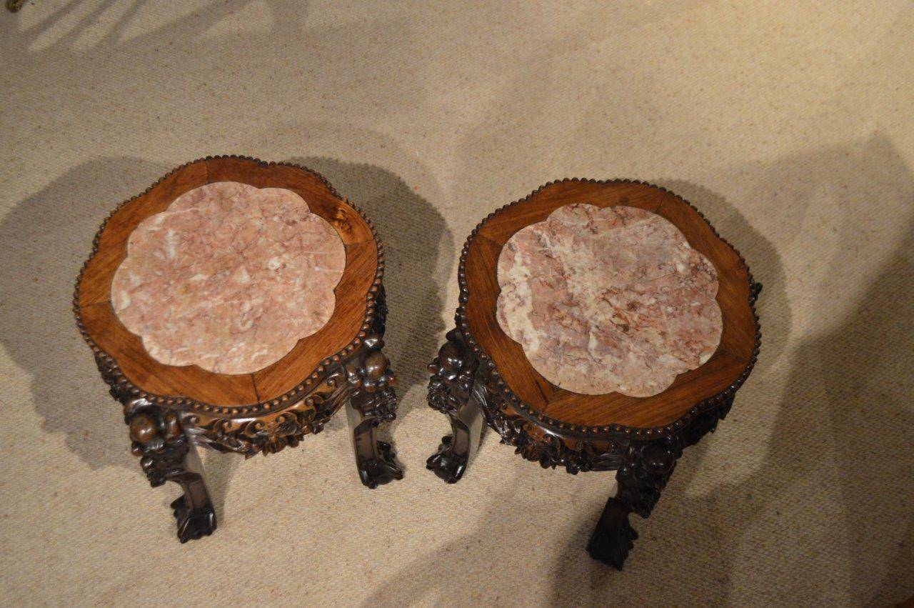 A good pair of hardwood Chinese stands of traditional form with shaped rouge marble inset tops. Having finely carved pierced aprons and typical Chinese cabriole supports with claw and ball feet. Chinese circa 1880-1900

Dimensions: 16.5