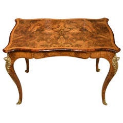 A Burr Walnut, amboyna 
Ormolu 19th Century French Style Library Table
