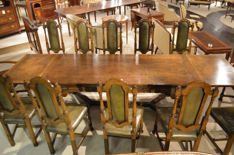 English An Oak Jacobean Style Refectory Table And Set Of 12 Oak Dining Chairs.
